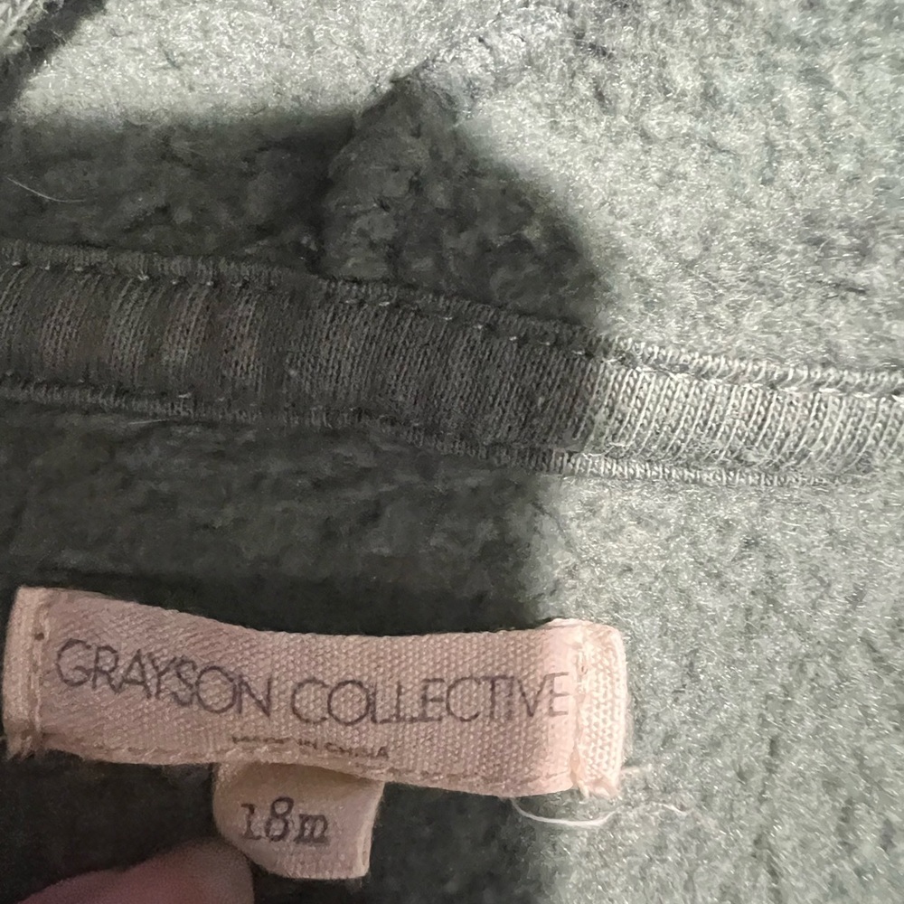 Boys 18 month Greyson Collective green romper with blue/gray stars.